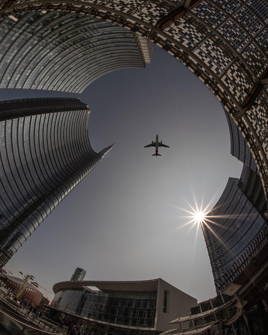 plane, city, architecture, sky, airplane, flight, travel, nature, sun, urban, buildings, tourism, outdoors, transportation, cityscape, skyline, tower, skyscrapers, lookup, aircraft